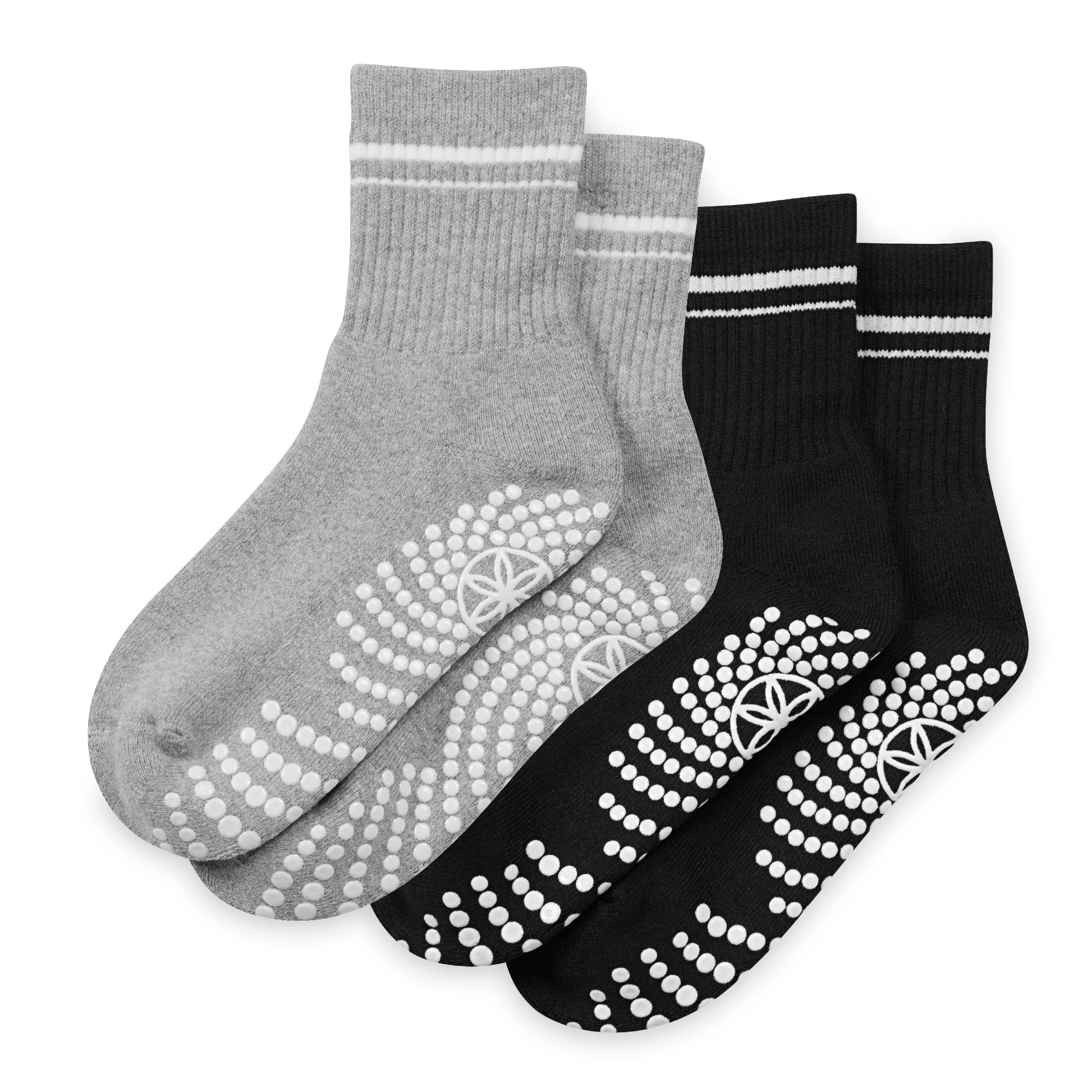 Two pairs of socks with textured sole patterns on a white background