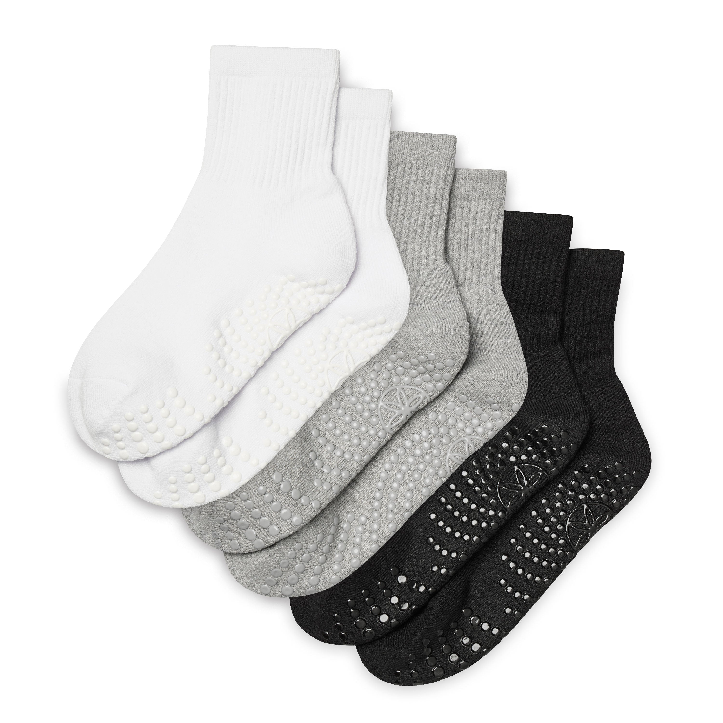 Set of five pairs of socks in white, gray, and black on a white background